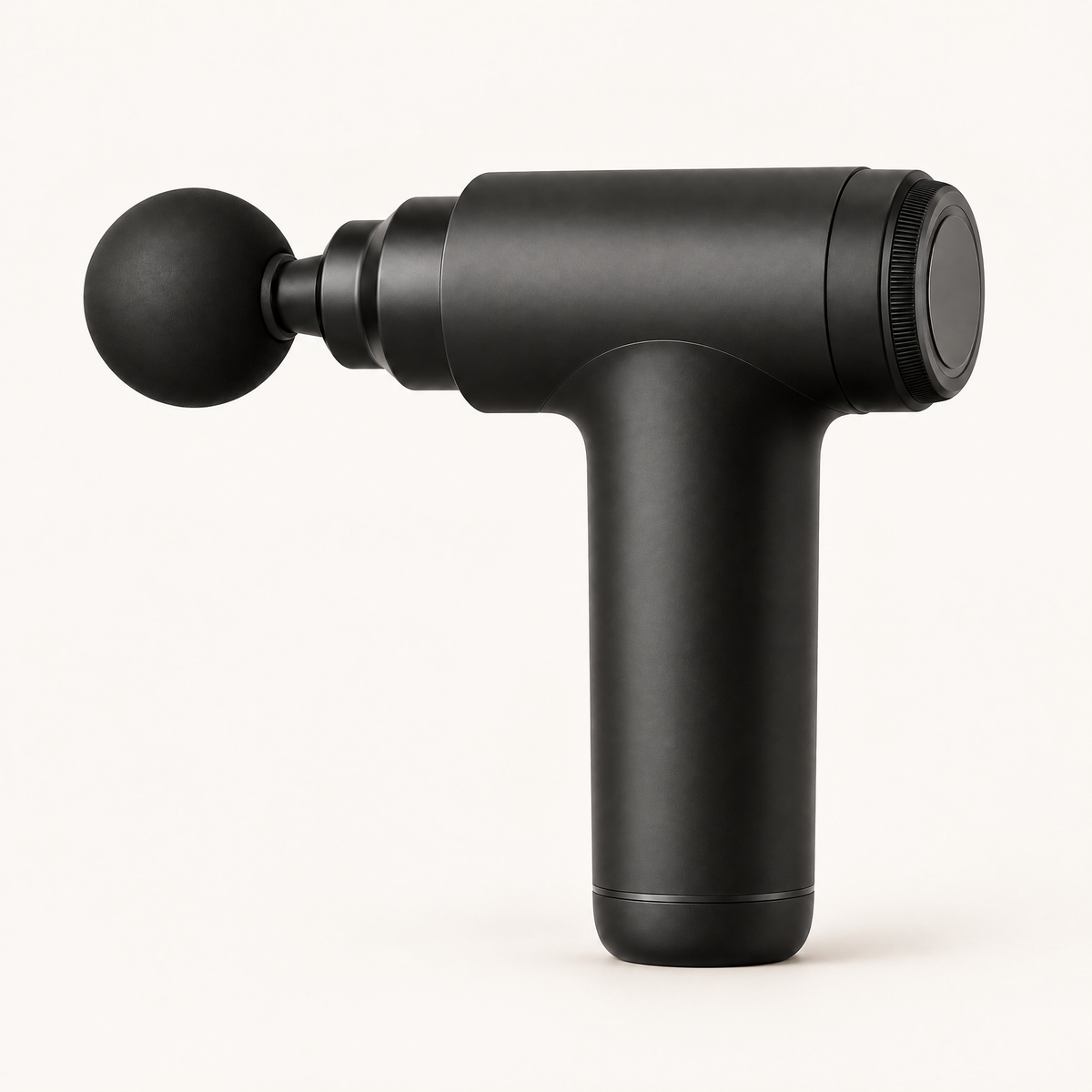 Mini pistolet de massage Shapebox Go noir mat, vu de trois quarts sur fond crème